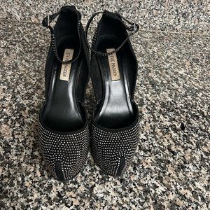 Steve Madden Black with silver studs, and ankle strap platform shoes.